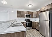 Thumbnail 20 of 32 - Bright Kitchen at Red Rock Apartments, South Dakota