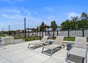 Thumbnail 63 of 74 - Patio with Lounge Chairs at The Flats at Riverwoods, Provo
