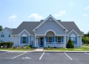 Thumbnail 1 of 3 - a house with a parking lot in front of it