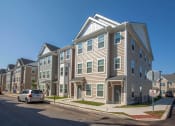 Thumbnail 2 of 6 - a row of town houses on a city street