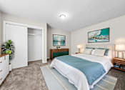 Thumbnail 12 of 17 - A bedroom with a large bed and a painting on the wall.at Signature Collection, Tuscaloosa, AL