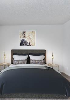 a bedroom with a bed and a window at Eastwood Crossings in Kansas City, Missouri