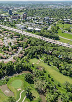 an aerial view of a park with a city in the background at Lodge of Overland Park Apartments, Overland Park , 66212