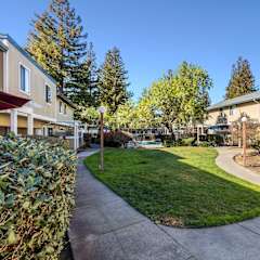 view of apartment buildings and landscaping at Redwood Landing Apartments, California