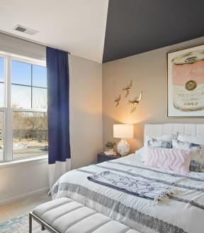 a bedroom with a large window at Heights at Glen Mills, Glen Mills, PA