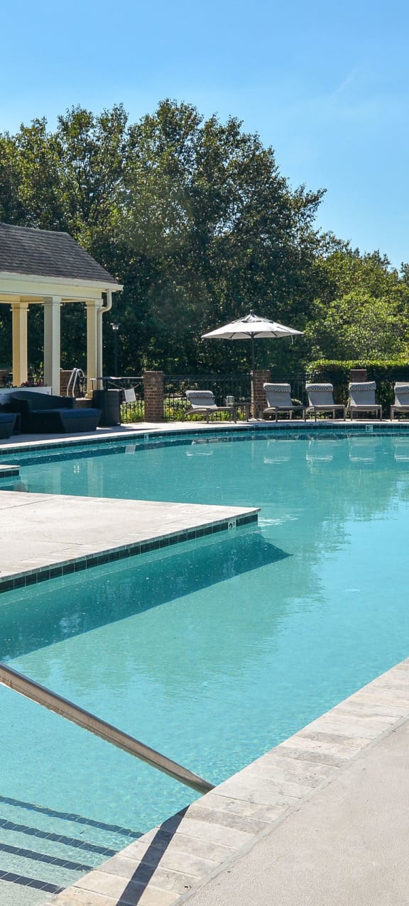 the resort style pool is in front of the pool house at Ashford Green, Charlotte, 28262