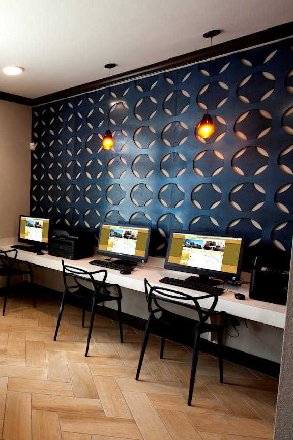 A reception area with a piano and chairs.