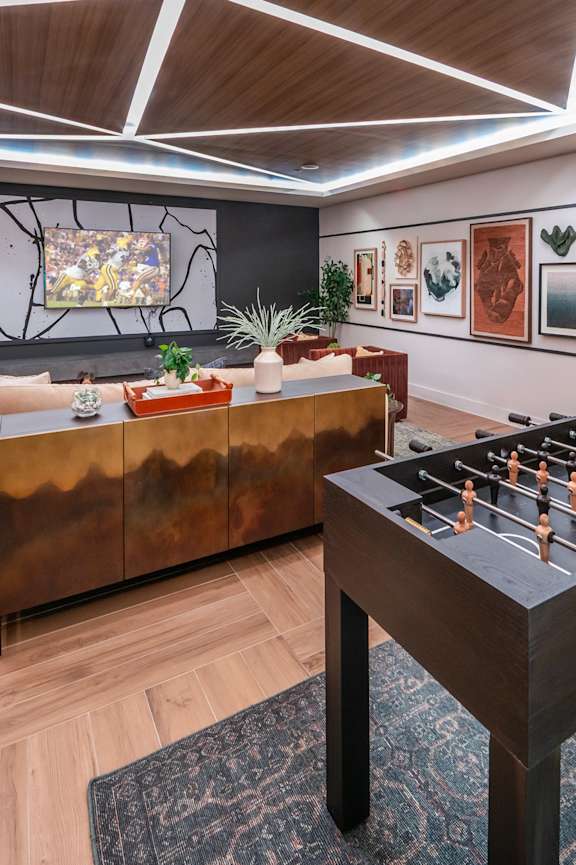 Social lounge foosball table at Heights at 1520 Apartments in Houston TX