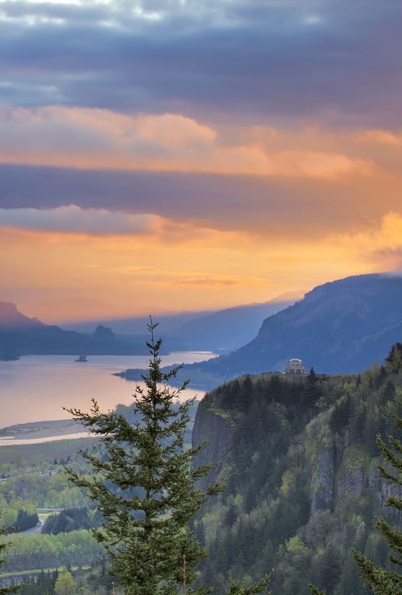 Scenic photo pf mountains and a large river