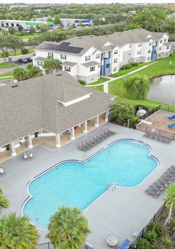 our apartments have a large pool and a building with a tree