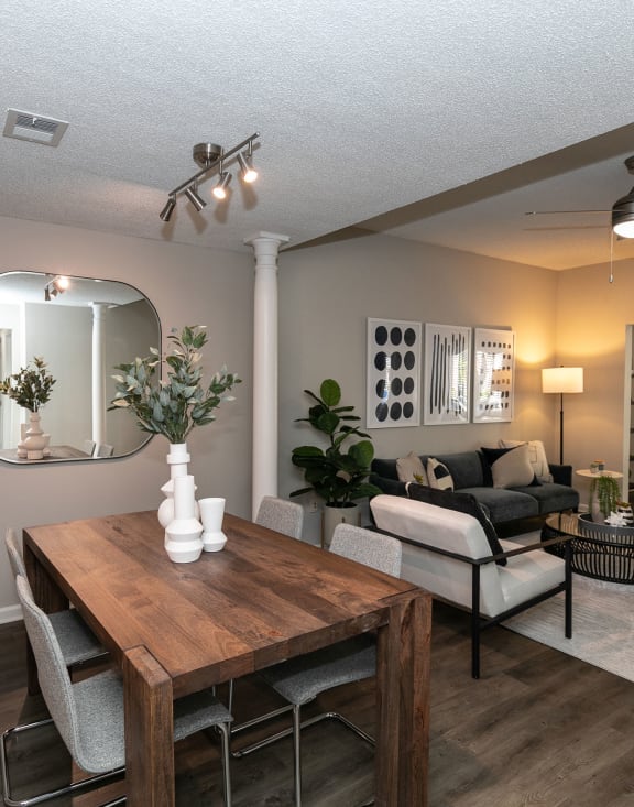 an open living room and dining room with a table and chairs at Willowest in Collier Hills in Atlanta, Georgia 30318