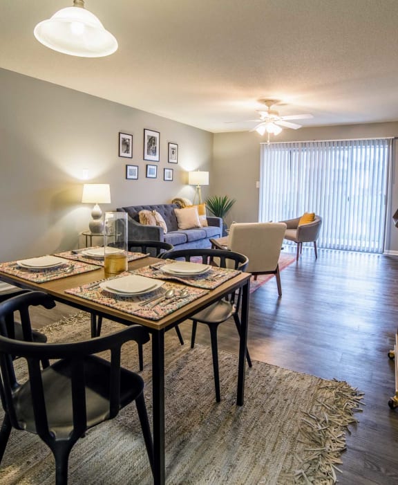 an open living room and dining room with a table and chairs