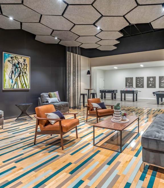 a living room with couches and chairs and a table