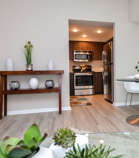 a living room with a dining room and a kitchen at Apartments at Denver Place, Colorado