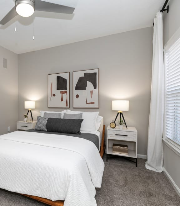 a bedroom with a large white bed and a ceiling fan at Willowest in Collier Hills in Atlanta, GA