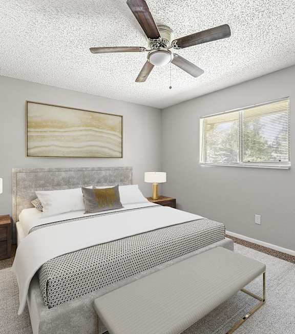 a bedroom with a bed and a ceiling fan at Northgate Townhomes in Tucker, 30084