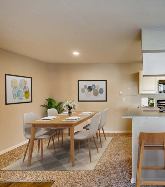A dining room with a table and chairs.