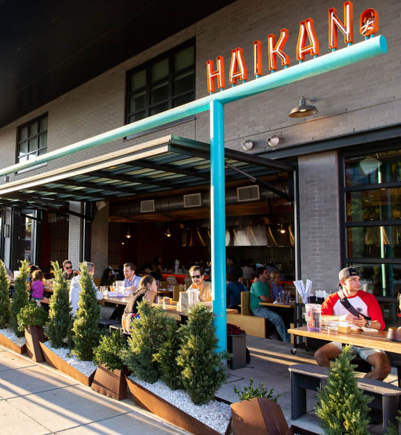 group of people eating at a table in a restaurant