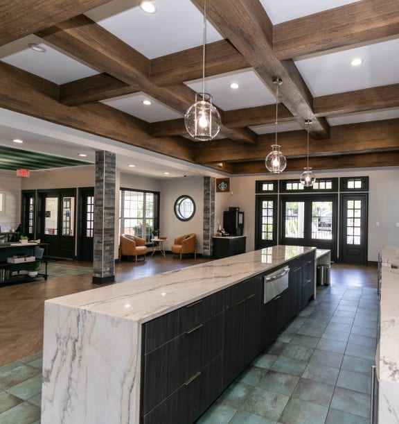 a kitchen with granite counter tops and a stainless steel refrigerator at Willowest in Collier Hills in Georgia 30318