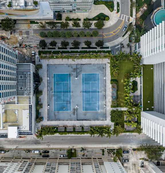 A large building with a pool and a mural on the side.