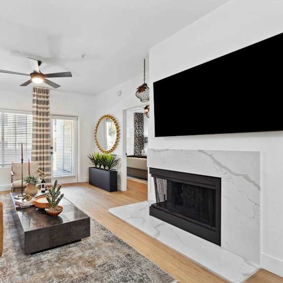 A living room with a fireplace and a couch.