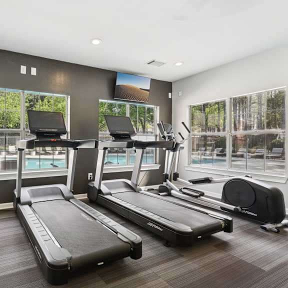 the gym is equipped with cardio machines and other fitness equipment at Gwinnett Pointe in Norcross, GA