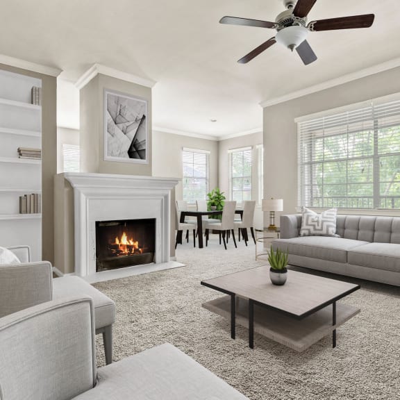a living room with couches and chairs and a fireplace at Villages of Cypress Creek, Houston, Texas