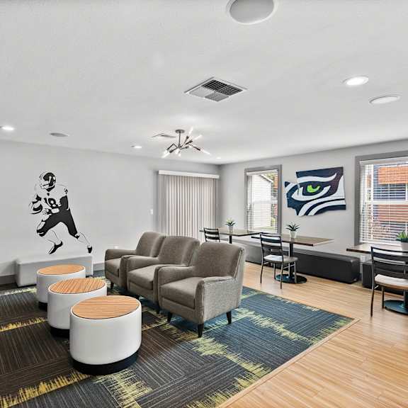 A room with a ceiling fan and a wall mural of a man playing golf.