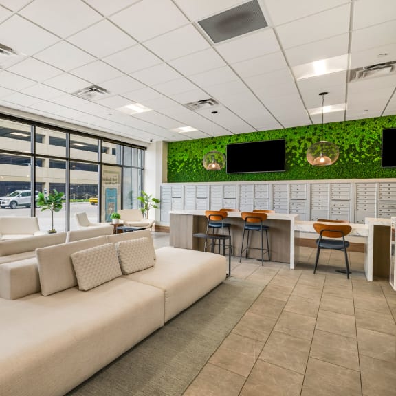 a rendering of a living room with a white couch and tables at Northern Lights a Lifestyle-Driven Community, West Fargo, ND