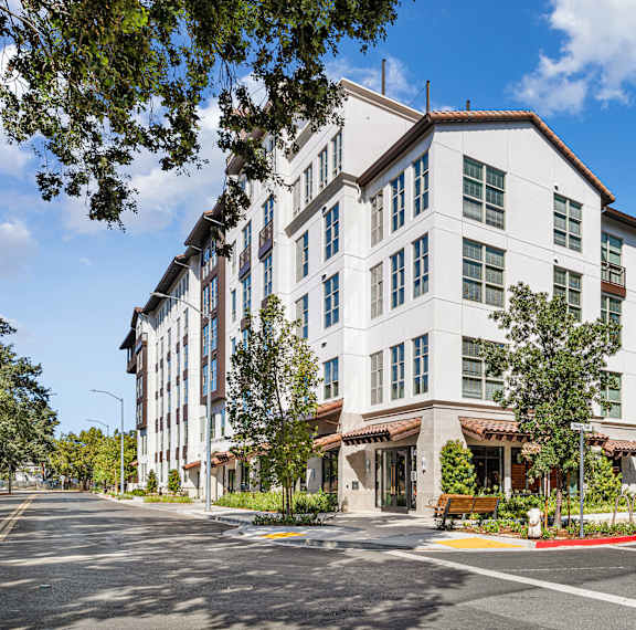 Corner view exterior photo showcasing sleek architecture and a welcoming entrance