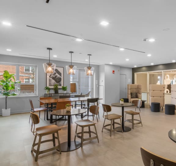 Pool table and kitchen area in newly renovated clubhouse  at Amelia, Quincy, Massachusetts