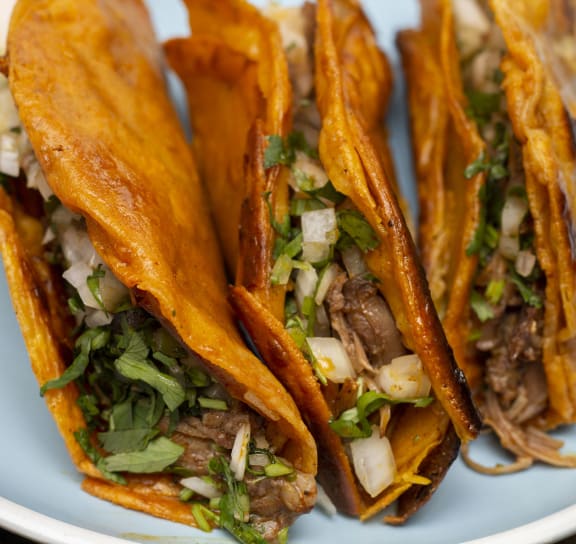 three tacos on a plate at Highland Mill Lofts in Charlotte, North Carolina 28205