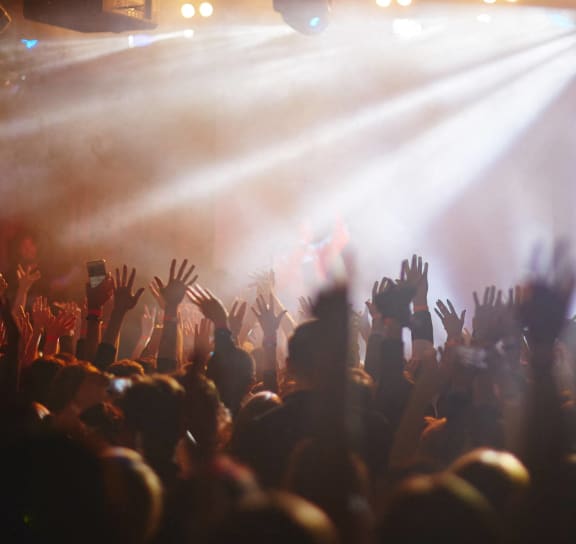 a crowd of people at a concert with their hands in the air at Stella, San Tan Valley Arizona