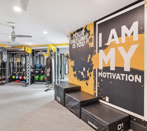 A gym with a sign that says "I am my motivation".