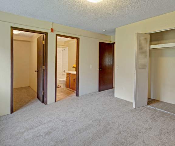 Two empty bedrooms at Arctic Sun Apartments. 