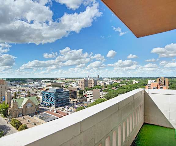 An arial view of with a view of the cityscape from a balcony at Marquis Towers Apartments. 
