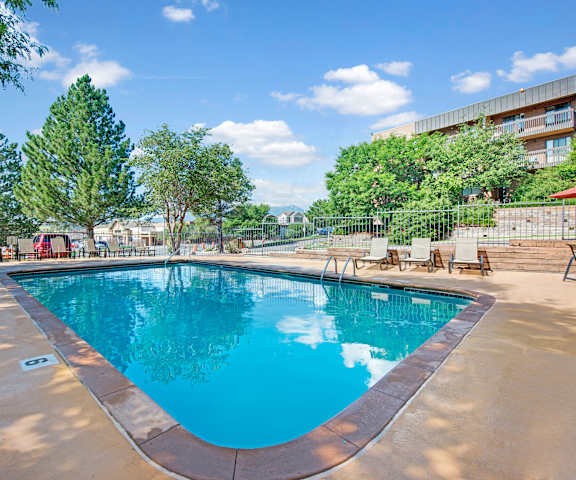 Eagle Ridge Swimming Pool Long View The outdoor pool with pool chairs, tables, and chairs at Eagle Ridge.