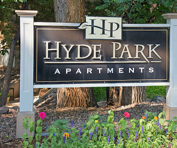 Hyde Park External Signage With Logo The black exterior sign and building of Hyde Park Apartments.