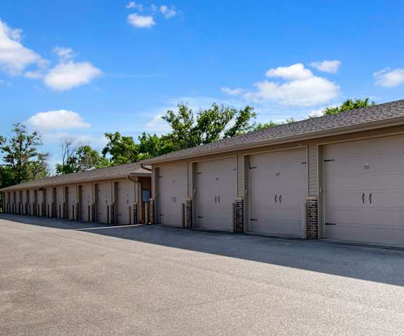 Williston Garden Exterior The tan rentable garages at Williston Gardens Apartment Homes.