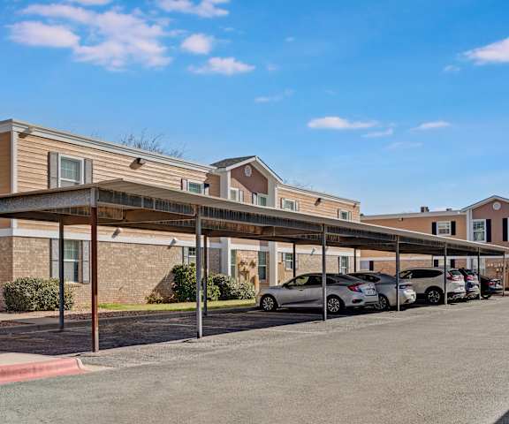 Golden Crest Covered Parking The exterior of the buildings and parking lot with covered parking at Golden Crest.
