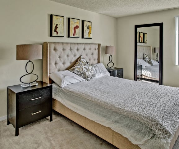 Furnished large bedroom with natural lighting at Andorra Apartments in Mountlake Terrace, WA