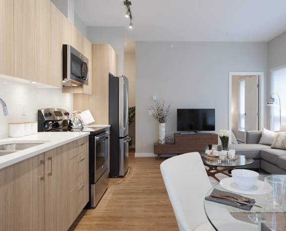 a kitchen and living room in a 555 waverly unit
