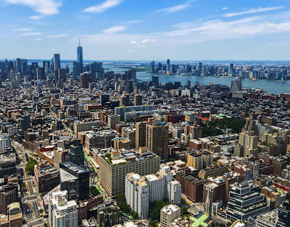 A cityscape with a mix of residential and commercial buildings.