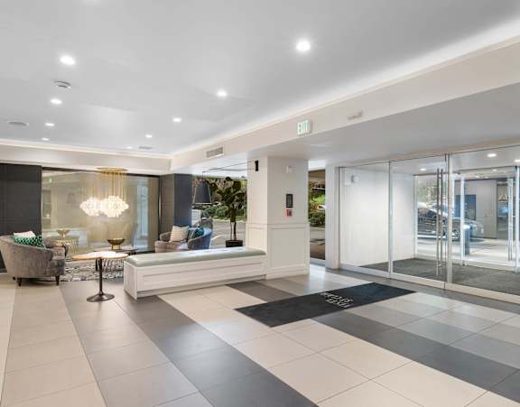 the lobby or reception area of a hotel with a reception desk