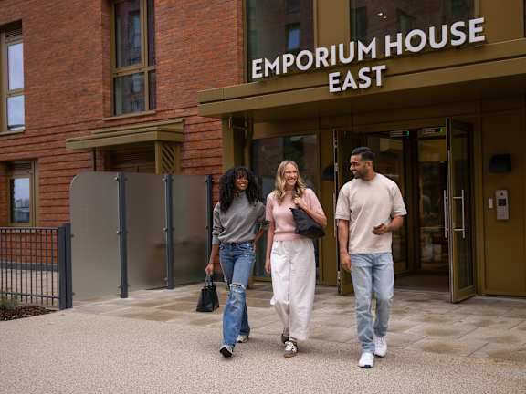 Three people walking at Emporium House Apartments, Reading, RG1 7NW