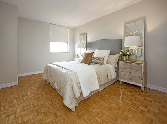 a bedroom with a bed and a dresser