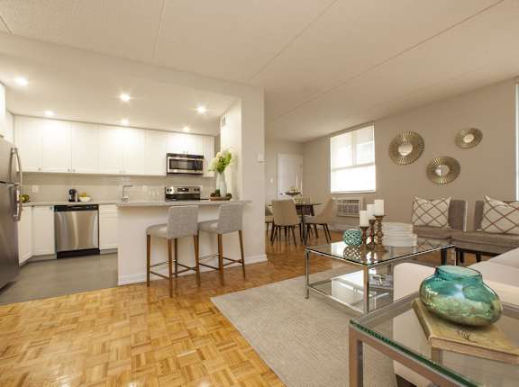 a living room with a kitchen and a dining room