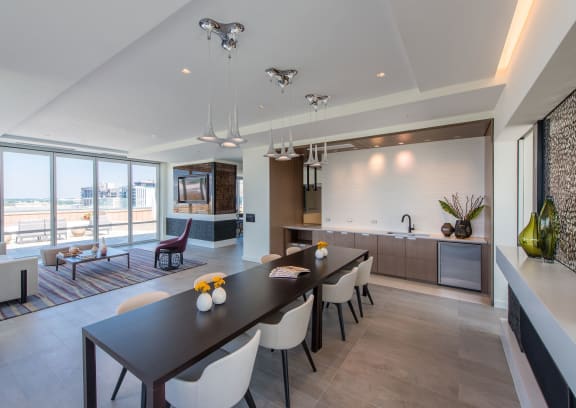 a kitchen with wooden cabinets and a marble counter top