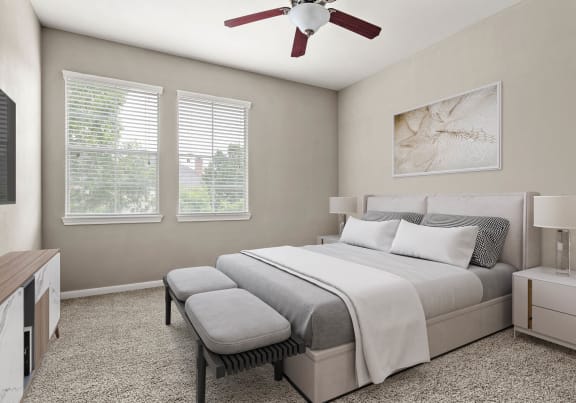 a bedroom with a bed and a geometric wallpaper on the wall