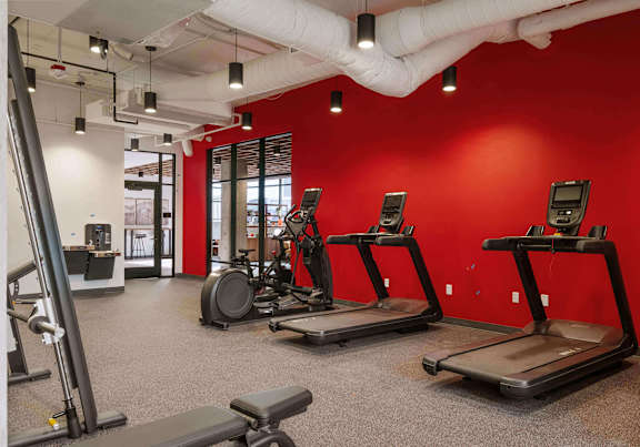 A fitness center with cardio equipment at Elevation16